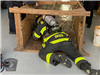 Firefighter Trains in Wire Work